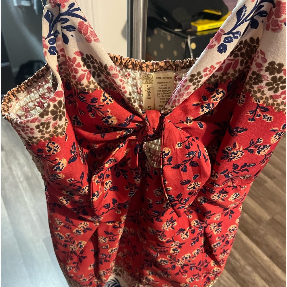 Cute romper with front bow/key hole. Size S.